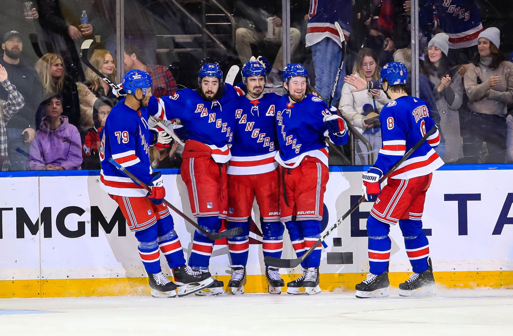 New York Rangers celebrate goal scored with teammates. NHL Best Bet. 