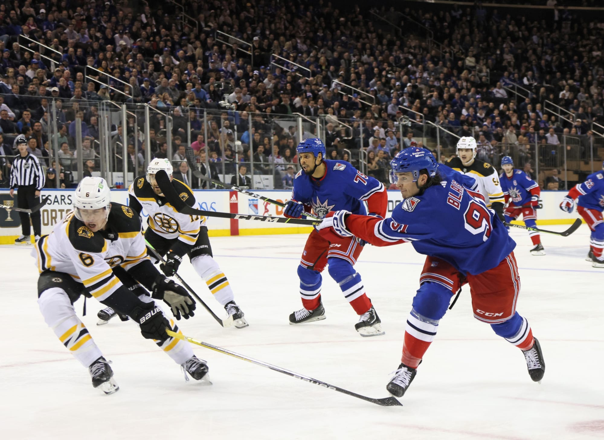 Brad Marchand, David Pastrnak and Hampus Lindholm of the Boston News  Photo - Getty Images