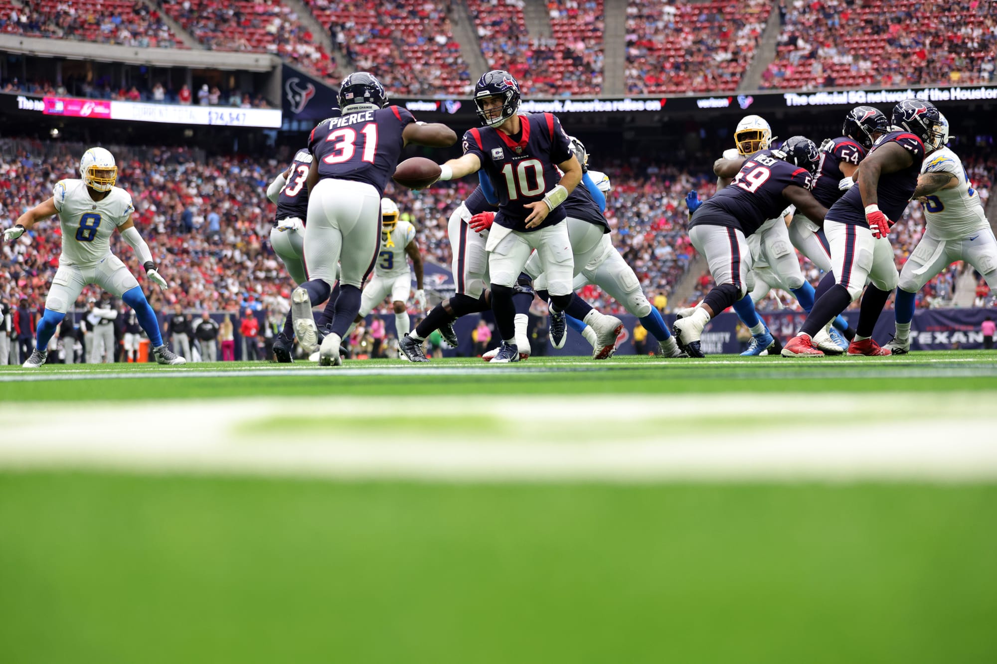 Houston, USA. October 2, 2022: Texans quarterback Davis Mills (10) drops  back to pass during an NFL game between the Texans and the Chargers on Oct.  2, 2022 in Houston. The Chargers