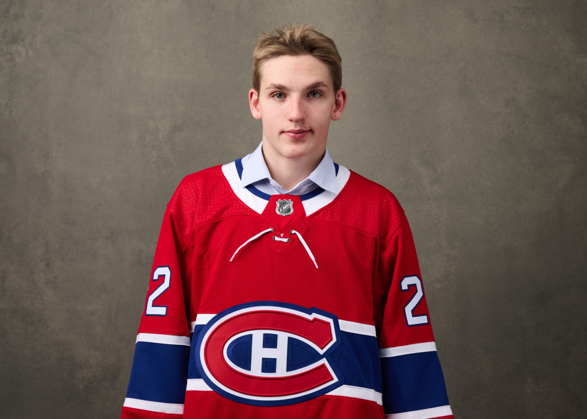 Lane Hutson in a Boston University jersey : r/Habs